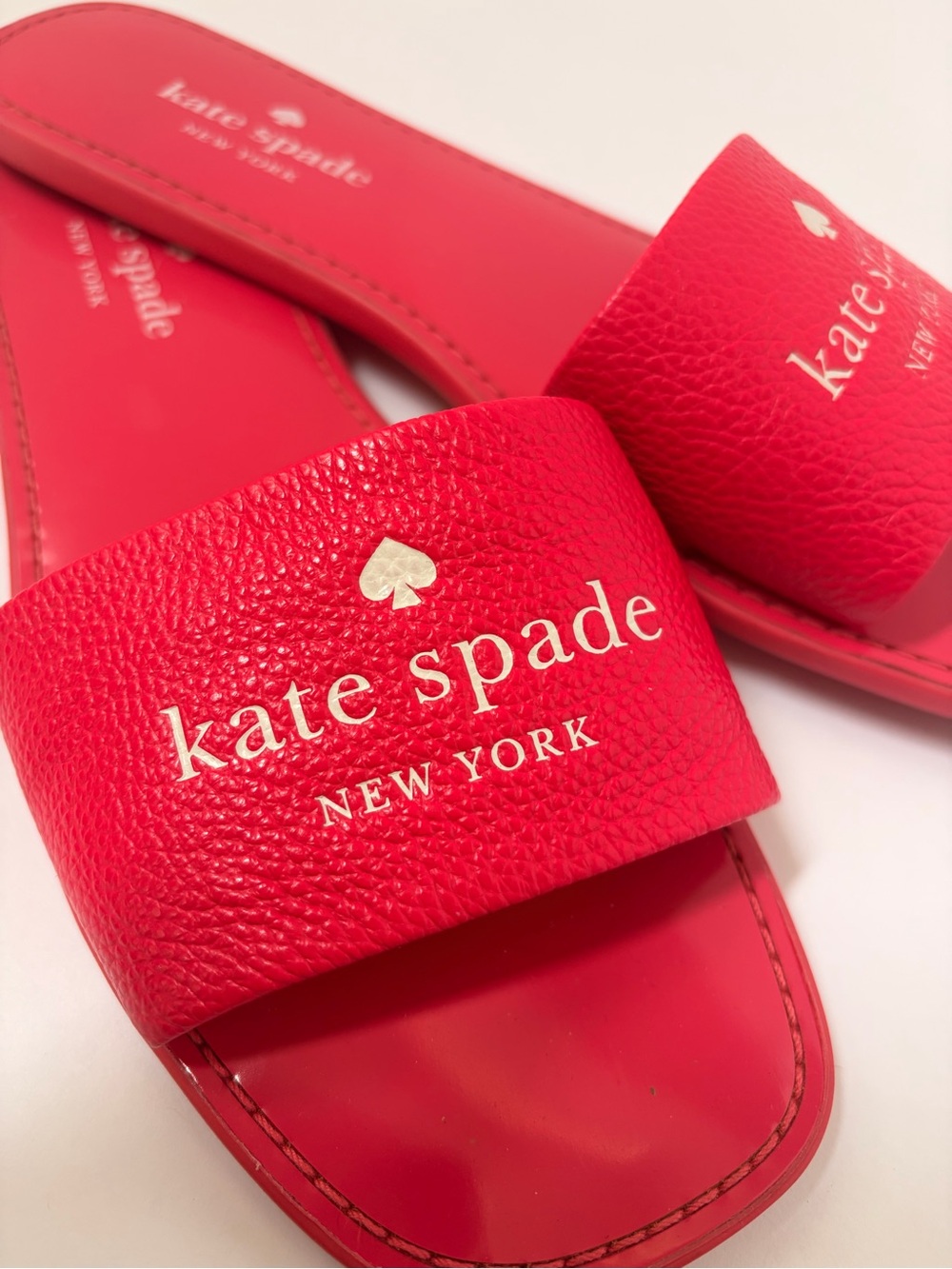 kate spade Pink Slide Sandals with Gold Logo